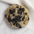 UniCookies Moo Moon, cookies n cream cookie with a peanut butter macaron baked in the center. Enlarged for detail.